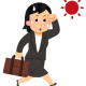 スーツを着て営業に回る女性
